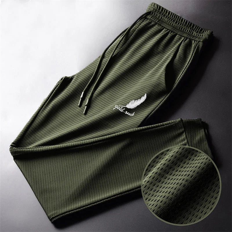 Men's Hollow Out Ice Silk Pants Mesh Breathable Casual Thin Quick Dry Pant Loose Elastic Beam Feet Pants Sports Fitness Trousers.