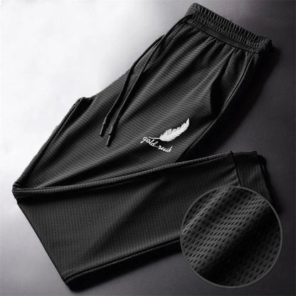 Men's Hollow Out Ice Silk Pants Mesh Breathable Casual Thin Quick Dry Pant Loose Elastic Beam Feet Pants Sports Fitness Trousers.