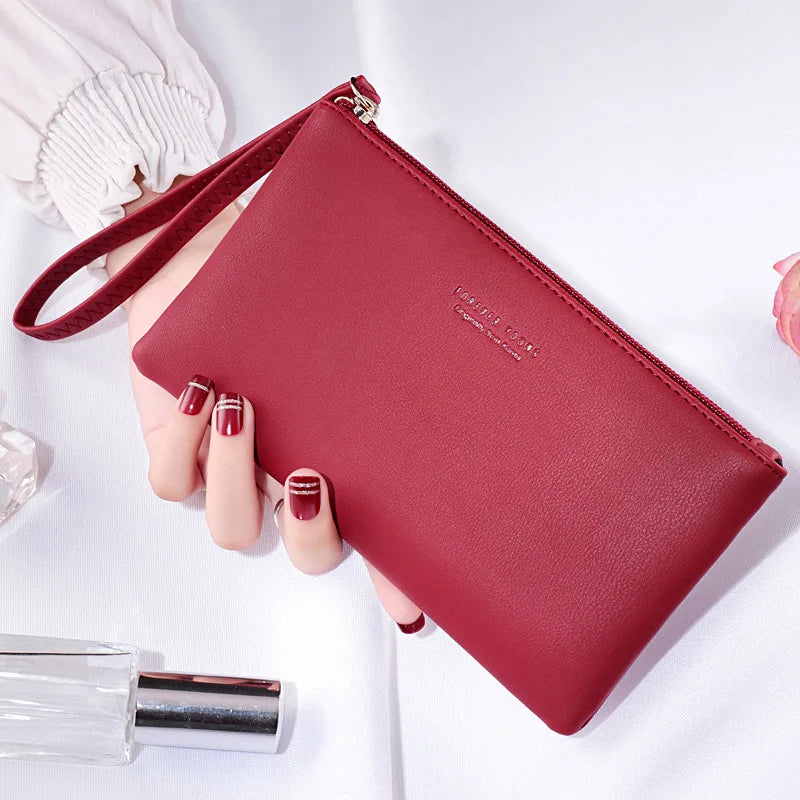 New mobile phone bag female long zipper coin purse female Korean version of pure color wild card bag mobile phone bag wallet.