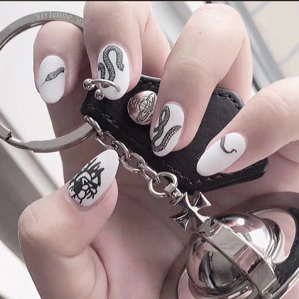 24pcs/set Long Stiletto Fake Nails Punk Snake Pattern Black White Matte False Nails Artificial Full Nail Tips Manicure Tools.