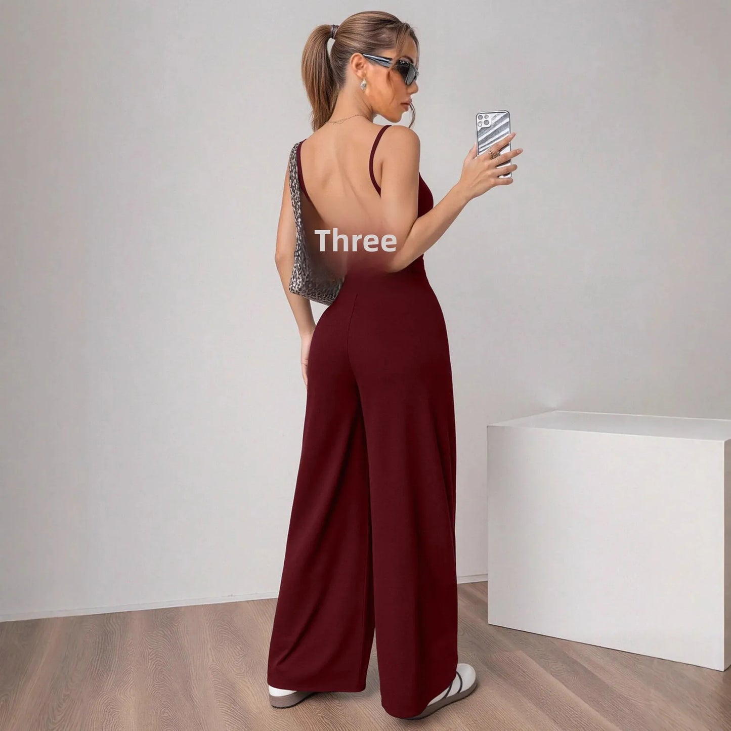 Fashionable Solid Color High Waist Bell Bottom Jumpsuit Backless Strap Casual Women's Long Pants One Piece Suit Female.