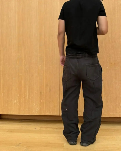 Casual Elastic Drawstring Zipper Pants High Street Hip Hop Streetwear Loose Fit Men's Trousers for Casual Scenarios.