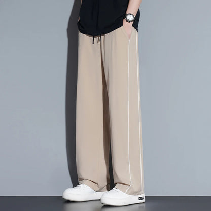 Summer ice silk thin section pants men's Hong Kong style loose splicing casual sports wide-legged pants elastic speed pants.