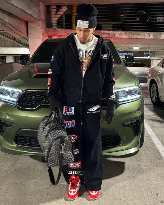 Black trendy patterned hip-hop sportswear set Y2K hooded zipper top with brand logo print and multiple badges streetwear fashion.