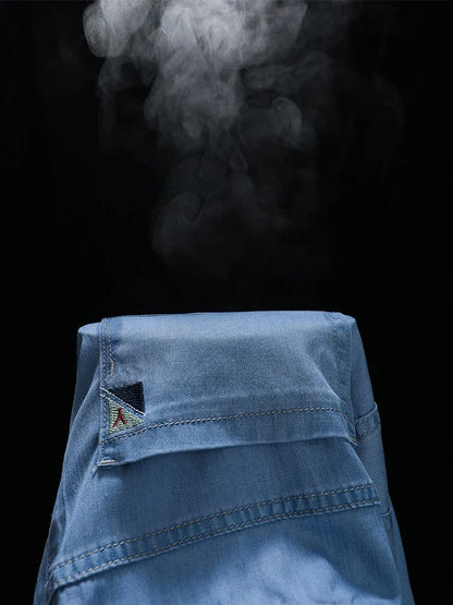 Summer Ultra Thin Men's Loose Jeans Lyocell Ice Silk Fashion Casual Business Denim Pants Straight Stretch Male Trousers.