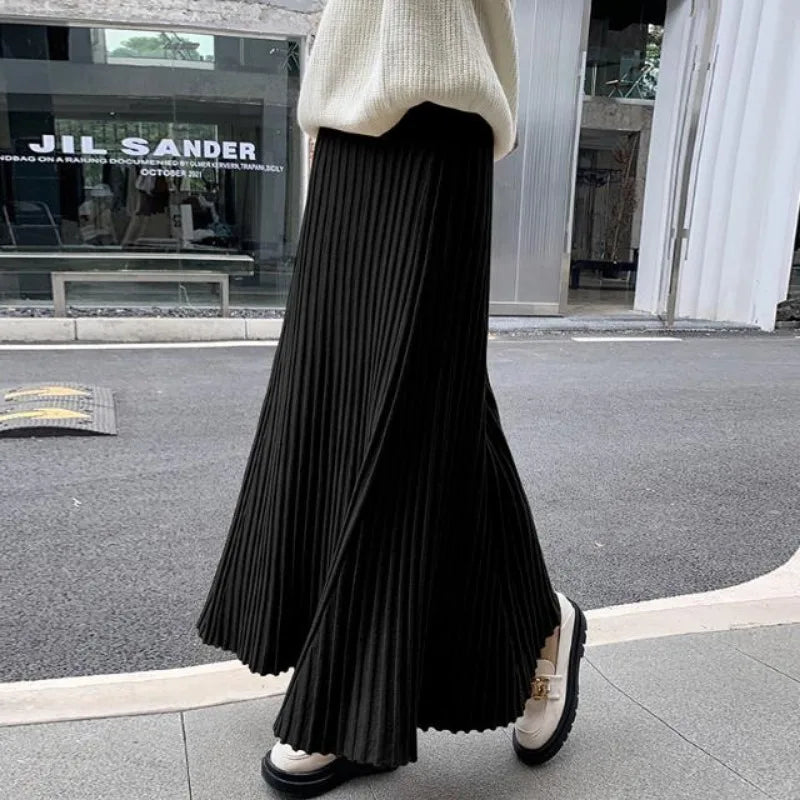 Knitted midi skirt women's A-line skirt high waist wide span mid length skirt.