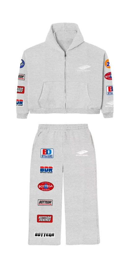 Black trendy patterned hip-hop sportswear set Y2K hooded zipper top with brand logo print and multiple badges streetwear fashion.