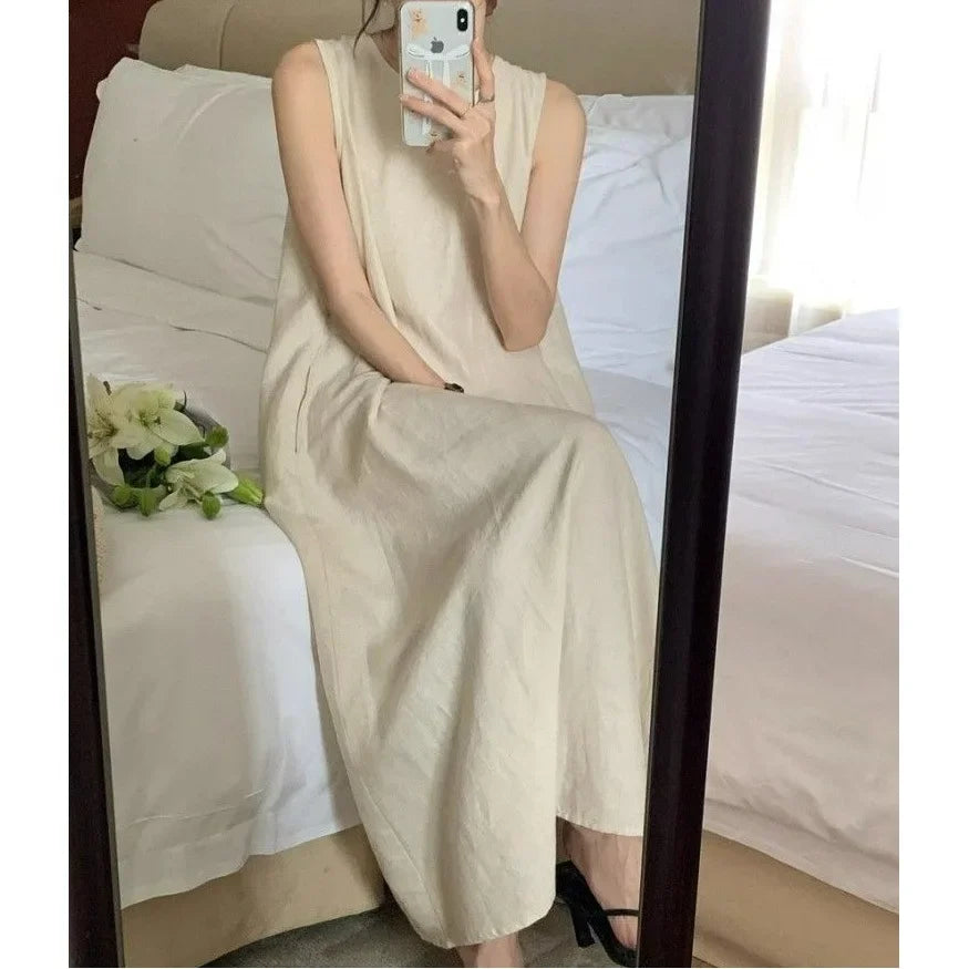 Elegantes ärmelloses langes Westenkleid für Damen, lockerer Rücken, hohles Design, Rundhalsausschnitt, Frühlingsausflugskleid, Prinzessinnenärmel, Polokragen.