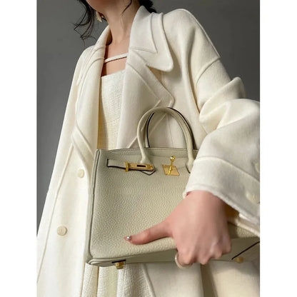 Weißer Mantel im französischen Stil, High-End-Temperament, Herbst-Winter, langer Wollmantel, 2025, neuer Damen-Wollmantel, modische lose Oberbekleidung.