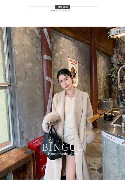 Grauer Wollmantel mit Krawatten-Taillenkollektion für Damen im Herbst und Winter 2024, neuer langärmeliger, lockerer High-End-Cape-Mantel, mittellanges Oberteil