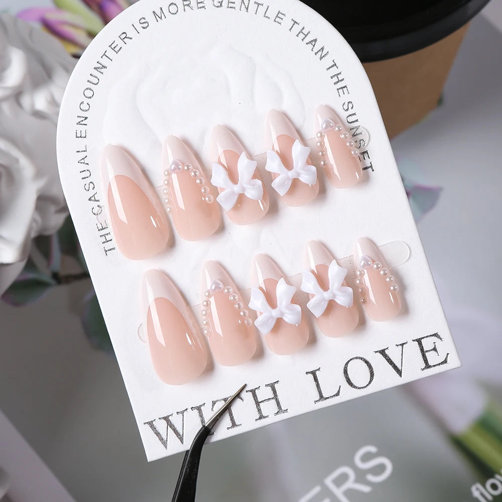 24pcs(+Tools) Pearl Bow Nude Pink Press On Nails White French Fingertips Almond Full Cover Fasle Nails New Year Nail Accessories.
