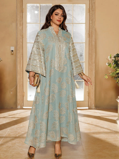 Muslim Women's Light Blue Islamic Embroidered Abaya with Gold Detailing Ideal for Formal Events in Middle East like UAE Saudi.