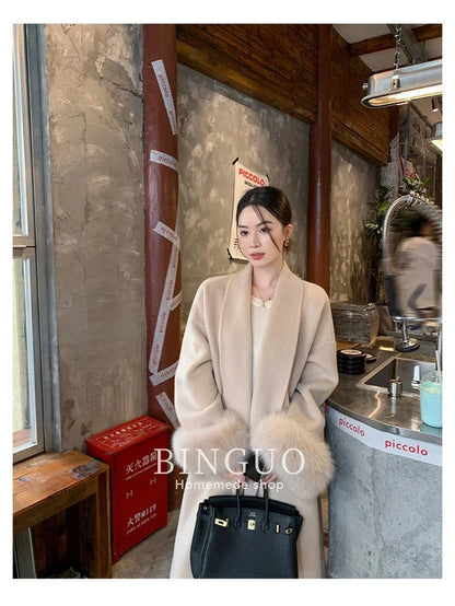 Grauer Wollmantel mit Krawatten-Taillenkollektion für Damen im Herbst und Winter 2024, neuer langärmeliger, lockerer High-End-Cape-Mantel, mittellanges Oberteil