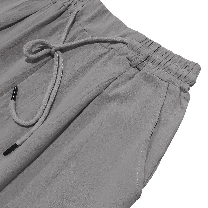 2024 drawstring men's simple fashion solid color casual cotton and linen straight trousers.