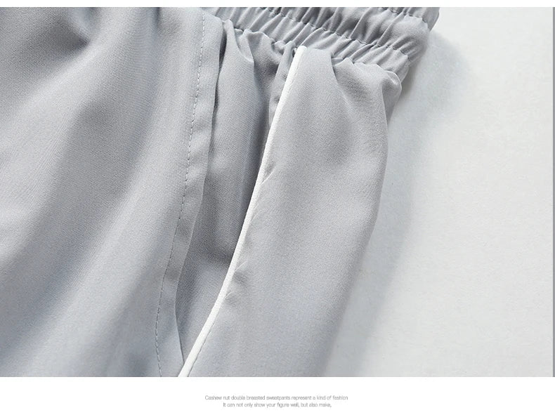 Summer ice silk thin section pants men's Hong Kong style loose splicing casual sports wide-legged pants elastic speed pants