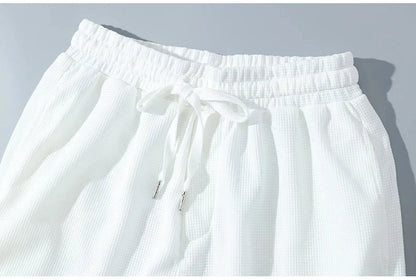 Summer fitness jogging loose sportwear set men's solid color short-sleeved casual T-shirt + shorts breathable two-piece set.