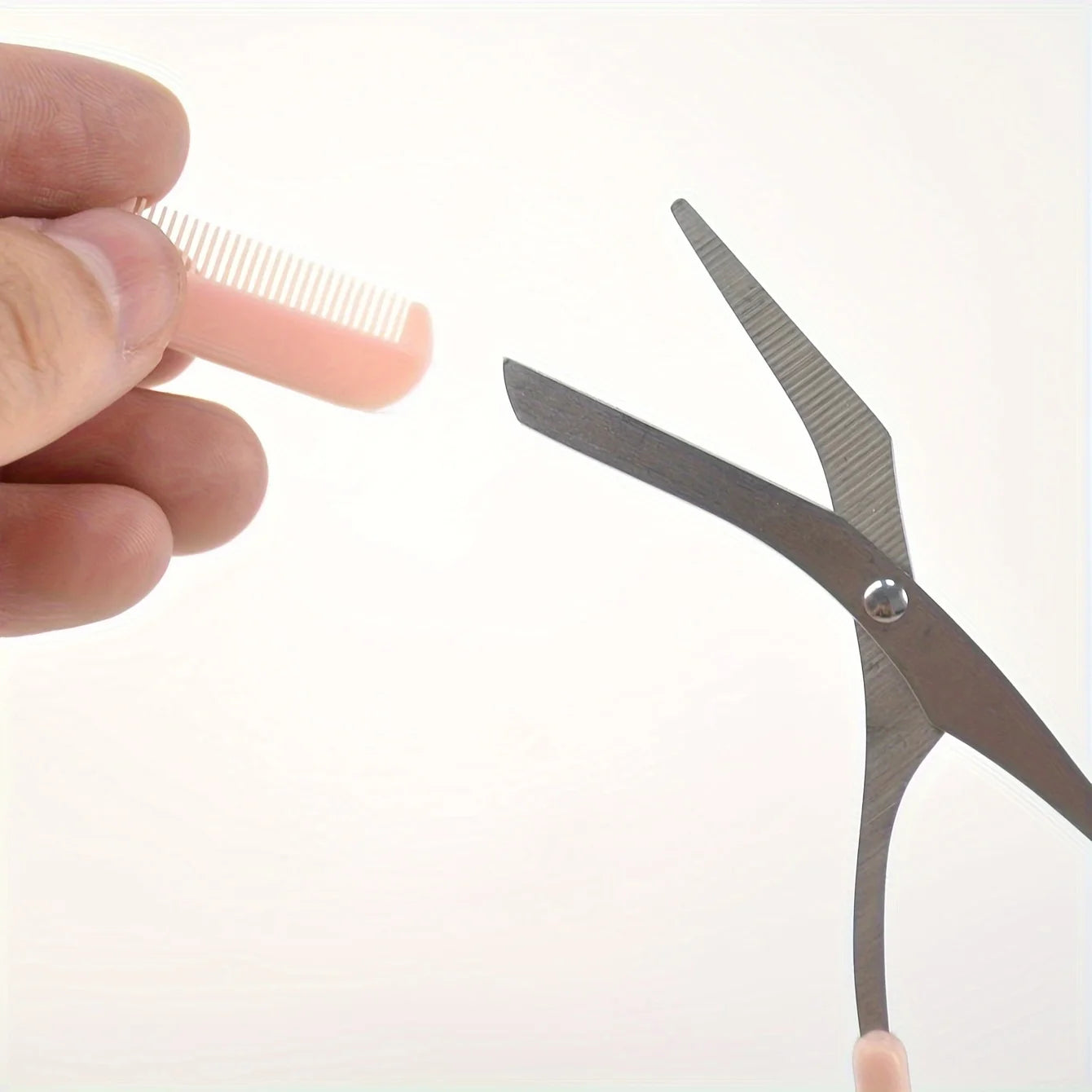 Pink eyebrow trimming scissors with built-in comb - stainless steel, precise grooming tool, creating perfect eyebrows.