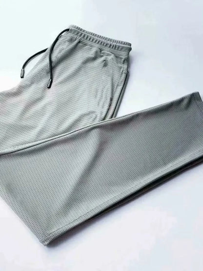2024 New Ice Silk Pants Summer Thin Breathable Mesh Pants Men's Casual Ice Cold Men's Other Material.