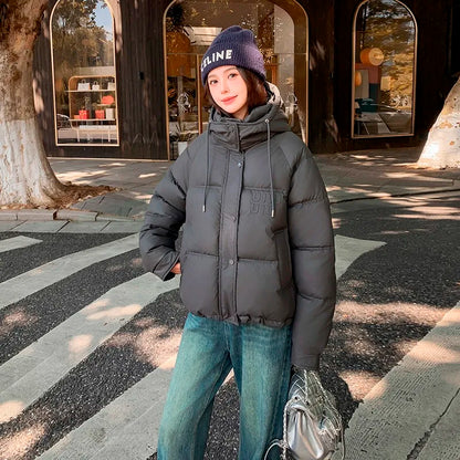 2024 Winter Neue frauen Unten Baumwolle Gefütterte Jacken Stilvolle Mit Kapuze Einfarbig Casual Verdicken Warme Lose anliegende kurze Mäntel.