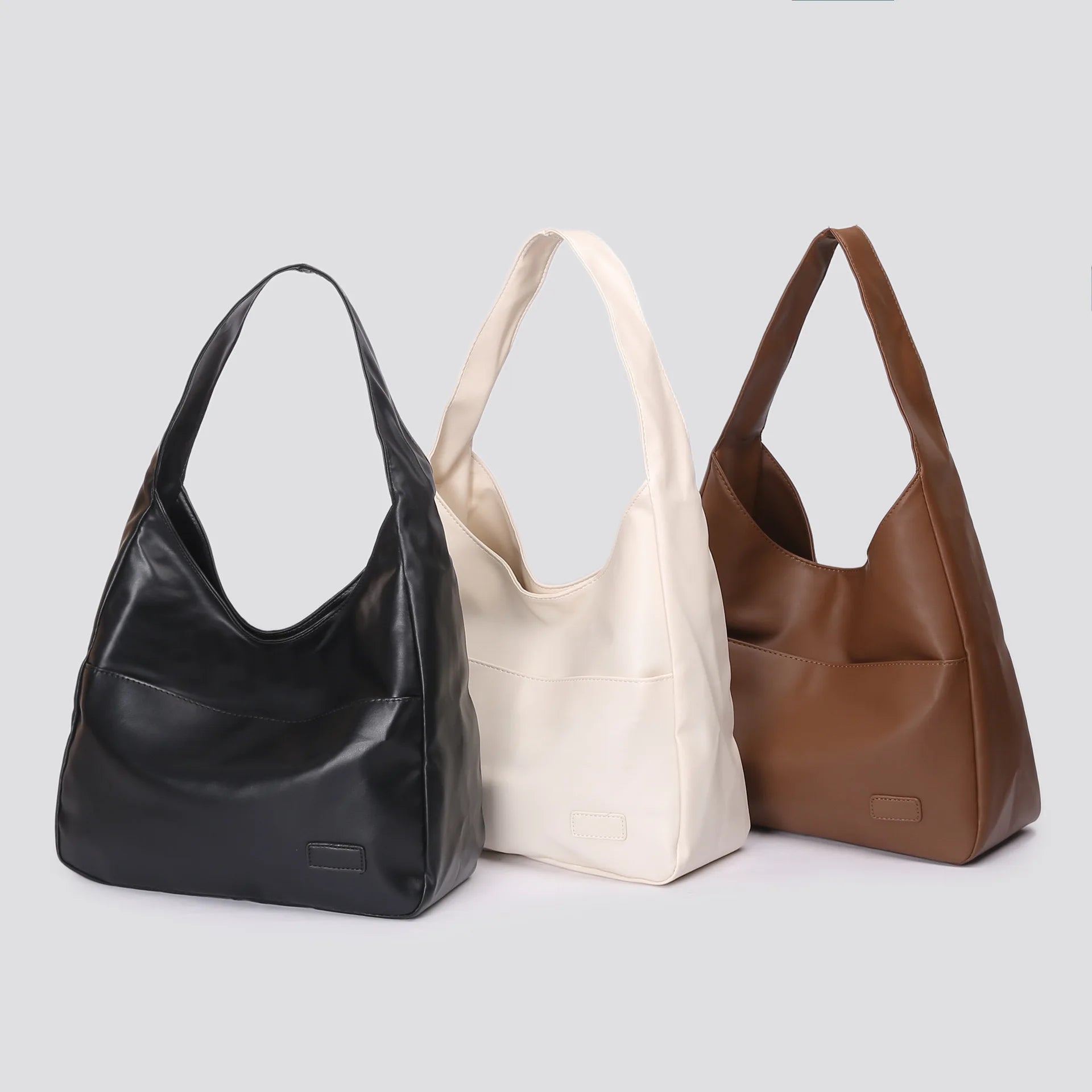 Large capacity tote bag, new black leather simple casual commuting women's bag, fashionable and versatile single shoulder bag.