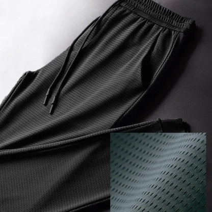 Men's Summer Ice Silk Pants Mesh Breathable Casual Thin Quick Dry Pants Loose Elastic Beam Feet Pants Sports Fitness Pants.