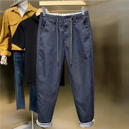 Frühling Herbst neue Mode einfarbige elastische Taille Jeans Herren bekleidung Kordel zug Taschen Chaopai lässig lose gerade Hosen.