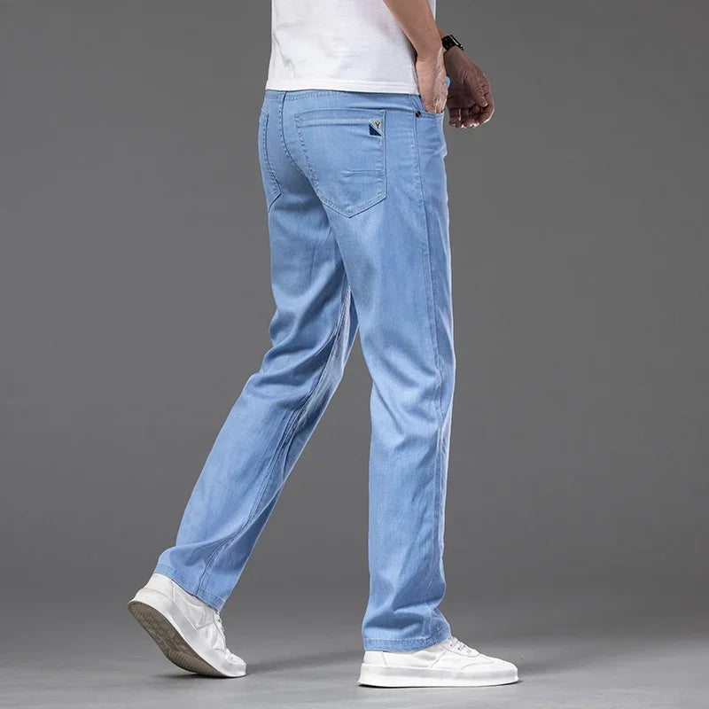 Summer Ultra Thin Men's Loose Jeans Lyocell Ice Silk Fashion Casual Business Denim Pants Straight Stretch Male Trousers.