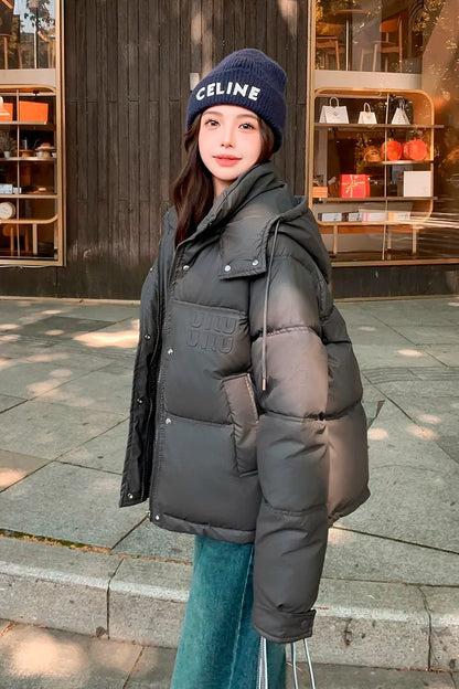 2024 Winter Neue frauen Unten Baumwolle Gefütterte Jacken Stilvolle Mit Kapuze Einfarbig Casual Verdicken Warme Lose anliegende kurze Mäntel.