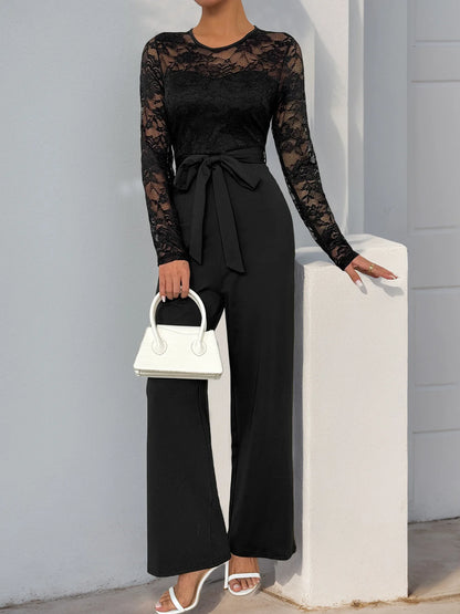 Woman Black Lace Sleeve Jumpsuit Round Neck Belted Waist Ideal for Evening Parties and Cocktail Events.
