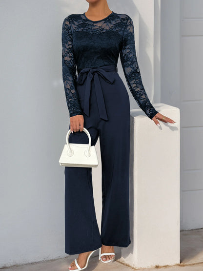 Woman Black Lace Sleeve Jumpsuit Round Neck Belted Waist Ideal for Evening Parties and Cocktail Events.