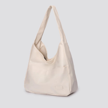 Large capacity tote bag, new black leather simple casual commuting women's bag, fashionable and versatile single shoulder bag.