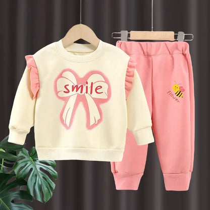 New 2025 Girls Fashion Cartoon Bowknot Letter Long Sleeve Pullover Sweatshirt + Pants Kids Spring Casual Sports Clothing Sets.