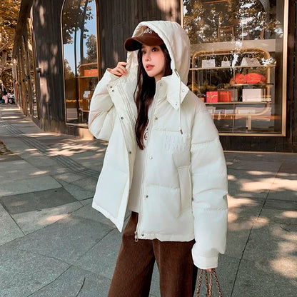 2024 Winter Neue frauen Unten Baumwolle Gefütterte Jacken Stilvolle Mit Kapuze Einfarbig Casual Verdicken Warme Lose anliegende kurze Mäntel