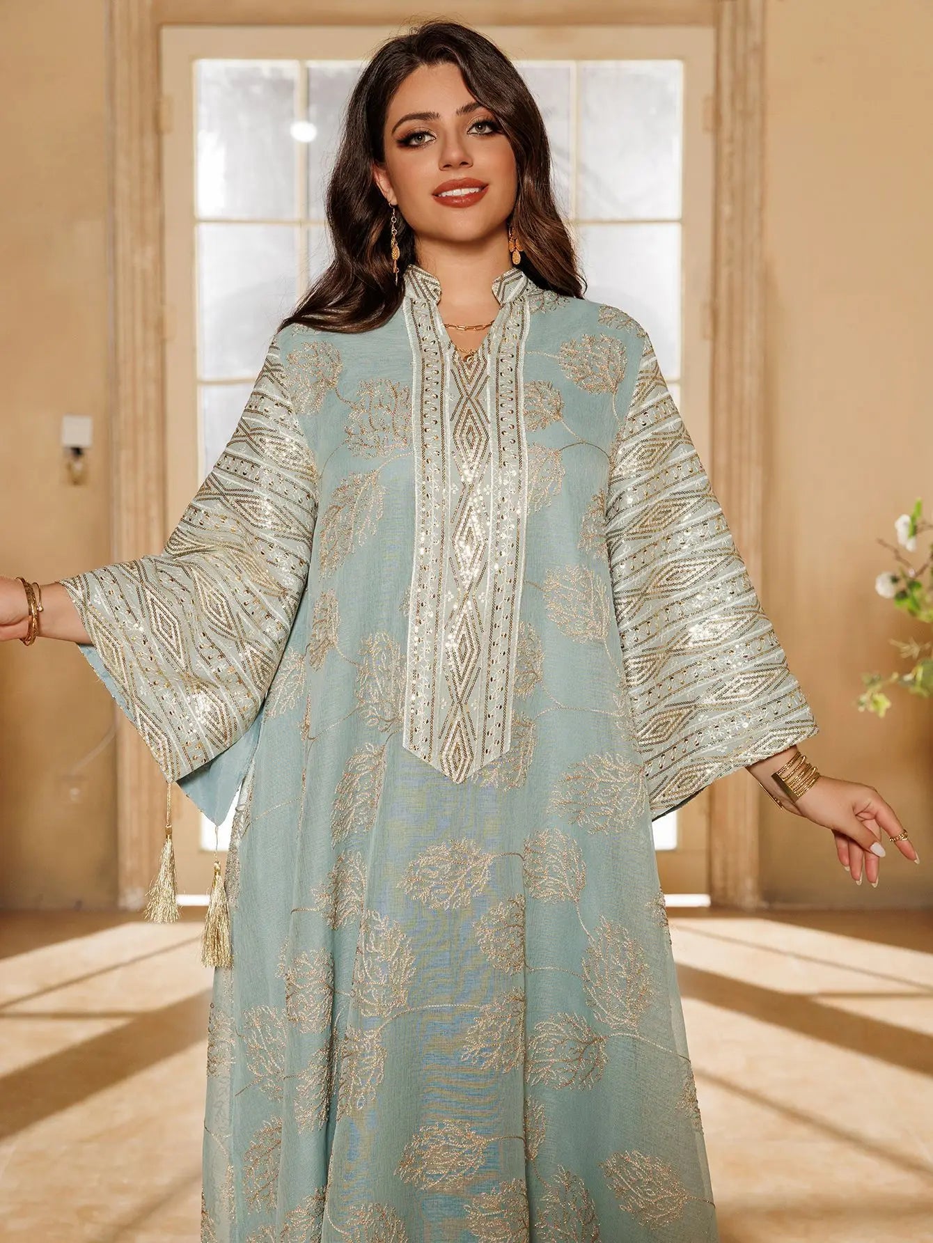 Muslim Women's Light Blue Islamic Embroidered Abaya with Gold Detailing Ideal for Formal Events in Middle East like UAE Saudi.