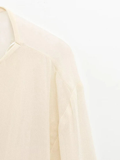 New spring women's clothing European and American style ruffled edge lace-up fake two-piece layered trumpet sleeve shirt.