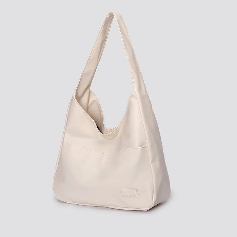 Large capacity tote bag, new black leather simple casual commuting women's bag, fashionable and versatile single shoulder bag.