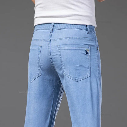 Summer Ultra Thin Men's Loose Jeans Lyocell Ice Silk Fashion Casual Business Denim Pants Straight Stretch Male Trousers.