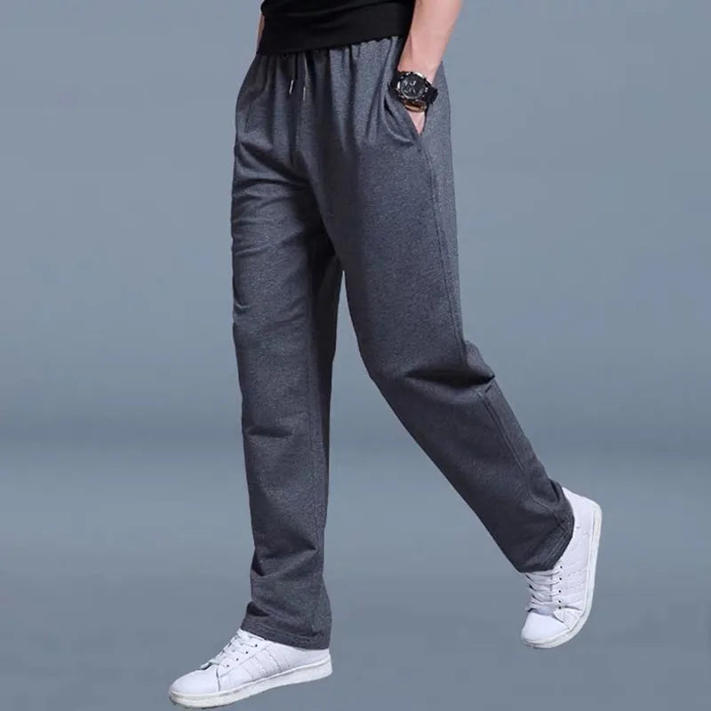 Men's solid color pants summer ice silk elastic quick drying loose sports pants suitable for casual and business wear ﻿.