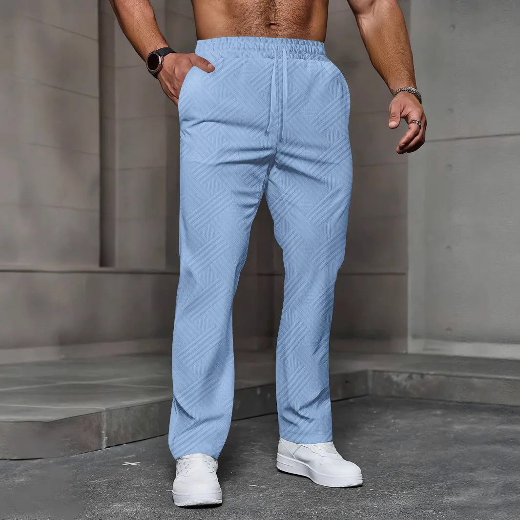 Men's sporty casual trousers, fashionable jacquard elastic waist street pants, solid-color loose all-season pants.