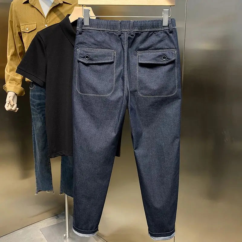 Frühling Herbst neue Mode einfarbige elastische Taille Jeans Herren bekleidung Kordel zug Taschen Chaopai lässig lose gerade Hosen.