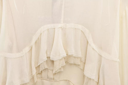 New spring women's clothing European and American style ruffled edge lace-up fake two-piece layered trumpet sleeve shirt.