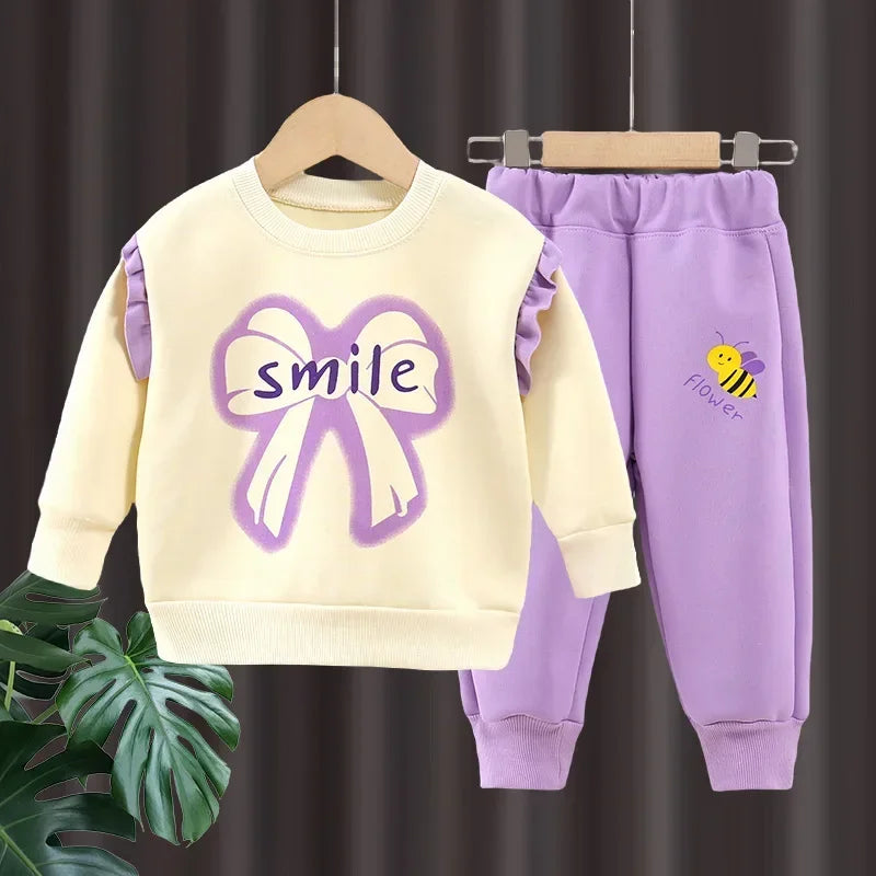 New 2025 Girls Fashion Cartoon Bowknot Letter Long Sleeve Pullover Sweatshirt + Pants Kids Spring Casual Sports Clothing Sets.