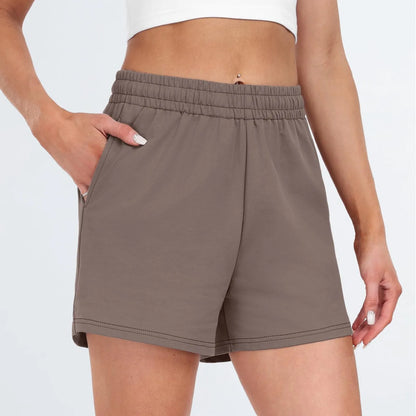 Plain Color Sports Shorts Casual Summer Comfortable And Soft Elastic High Waist Running Shorts With Pockets For Women.