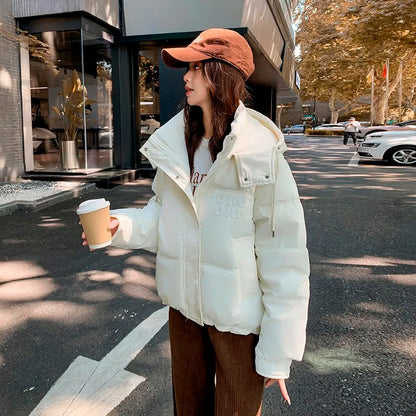 2024 Winter Neue frauen Unten Baumwolle Gefütterte Jacken Stilvolle Mit Kapuze Einfarbig Casual Verdicken Warme Lose anliegende kurze Mäntel
