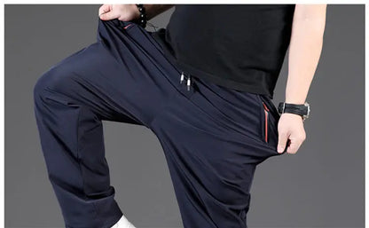 8XL Casual Pants Mens Straight Loose Trousers Men Clothing Elastic Waist Quick Dry Pants Summer Fashion Oversized Joggers Pants.