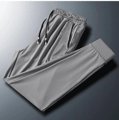 2024 New Ice Silk Pants Summer Thin Breathable Mesh Pants Men's Casual Ice Cold Men's Other Material.