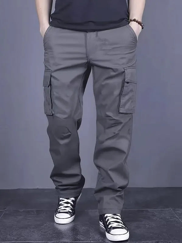 Men's casual multi pocket work pants with loose fit and drawstring waistband suitable for hikingfishingand outdoor exploration.