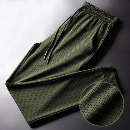 Men's Summer Ice Silk Pants Mesh Breathable Casual Thin Quick Dry Pants Loose Elastic Beam Feet Pants Sports Fitness Pants.