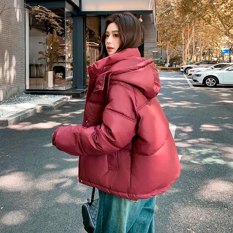 2024 Winter Neue frauen Unten Baumwolle Gefütterte Jacken Stilvolle Mit Kapuze Einfarbig Casual Verdicken Warme Lose anliegende kurze Mäntel