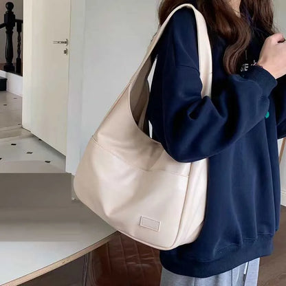 Large capacity tote bag, new black leather simple casual commuting women's bag, fashionable and versatile single shoulder bag.